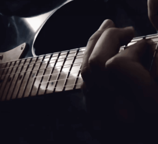 Playing guitar