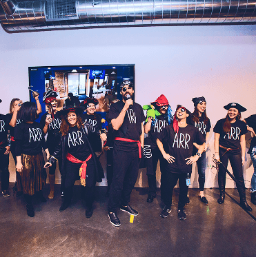 Leading the team in pirate costumes